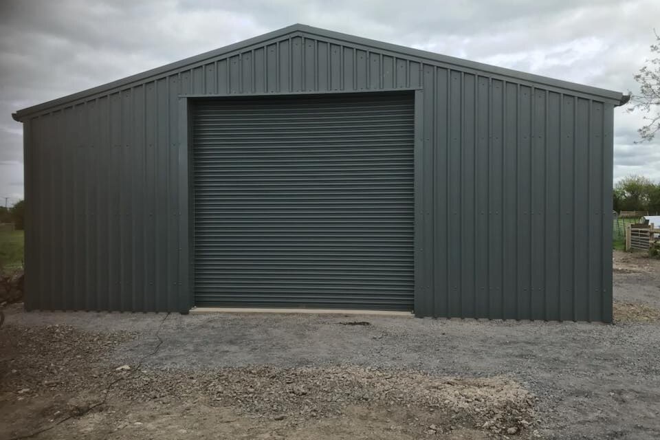 Steel frame workshop with roller shutter door